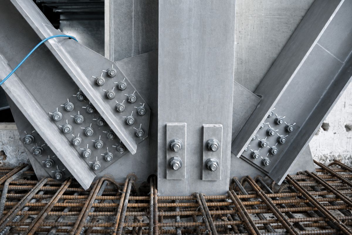 High-strength bolted connections joining structural steel beams on a construction site