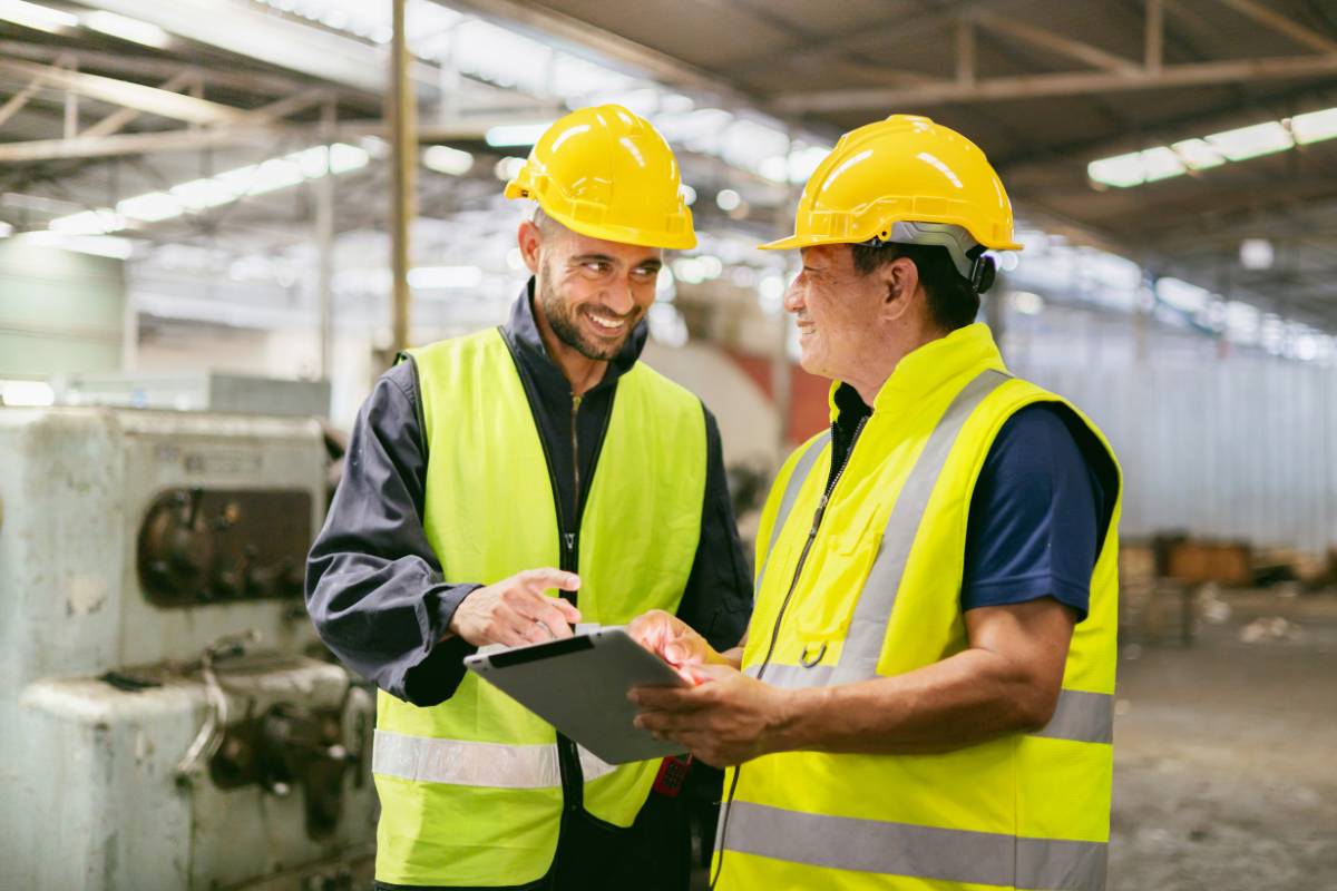 Two construction testing workers in a friendly discussion