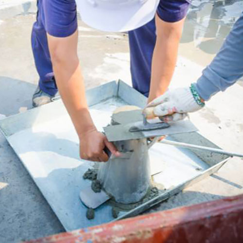 Field technician using a slump clone with concrete